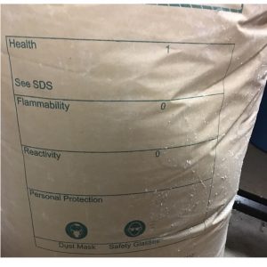 Brown paper bag with safety label.